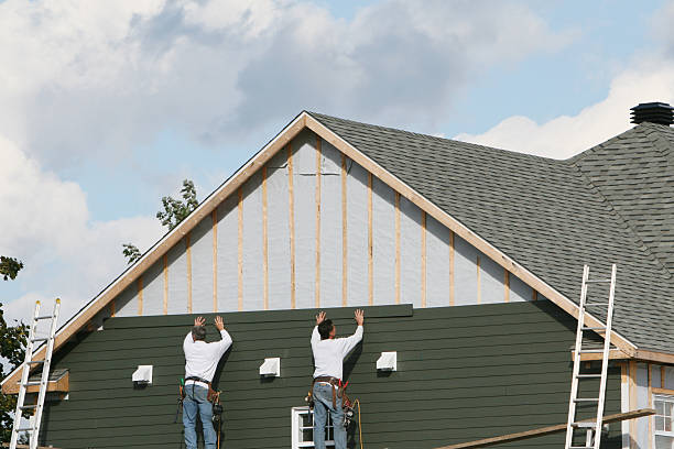 Professional Siding Contractor technician working in Triadelphia, WV
